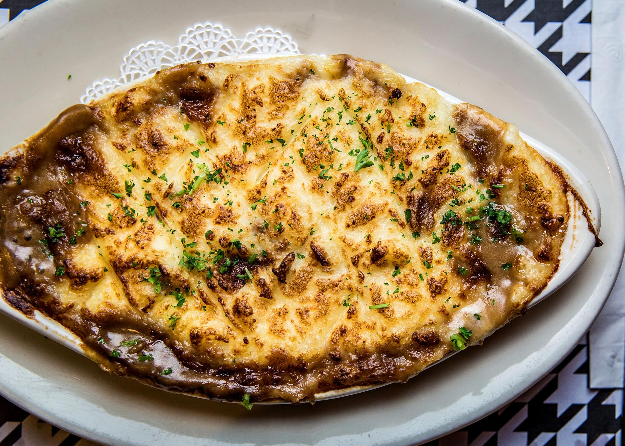 SHEPHERD’S PIE With ground lamb & sirloin, topped with a layer of whipped mashed potatoes