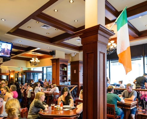 Interior group of diners at Houndstooth Pub with Irish Flag